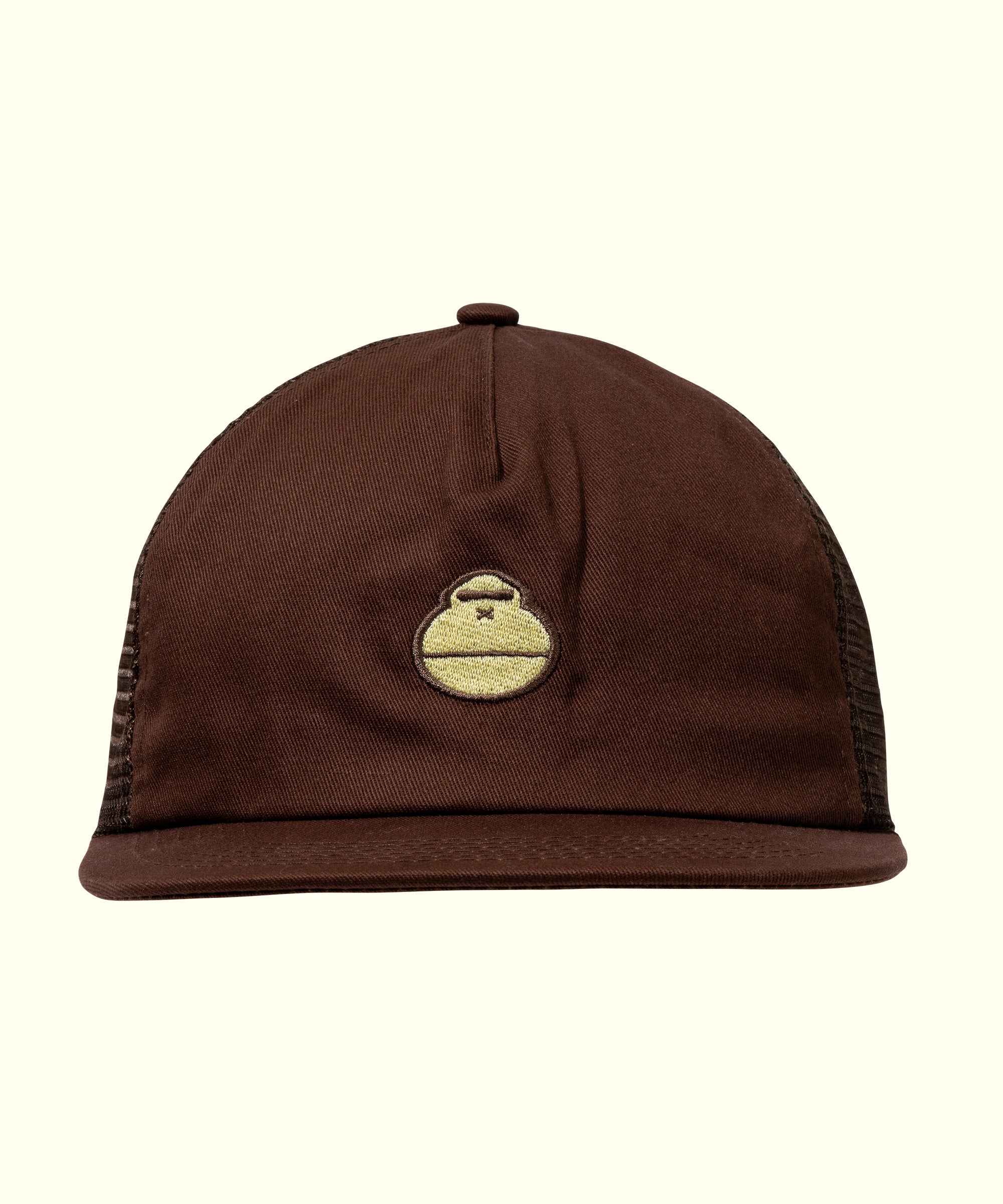 Brown trucker hat featuring a small, yellow hat icon on the front, mesh back for breathability, original trucker style by Sun Bum.