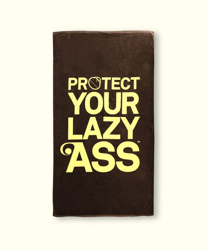 Brown 'PYLA' beach towel with bold yellow text reading 