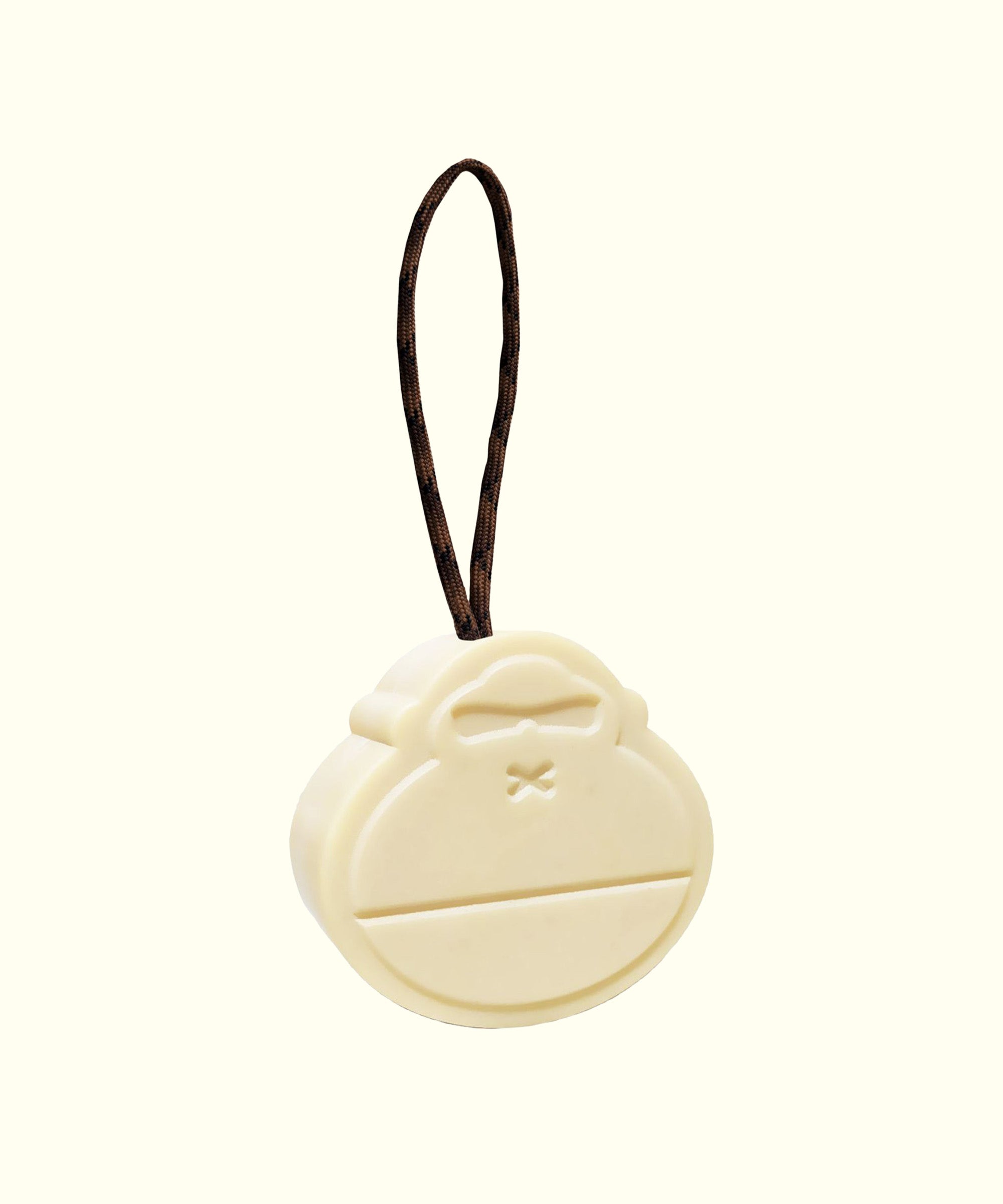 Soap on a Rope with brown cord, shaped like a monkey face, perfect for convenient shower use. Sun Bum.