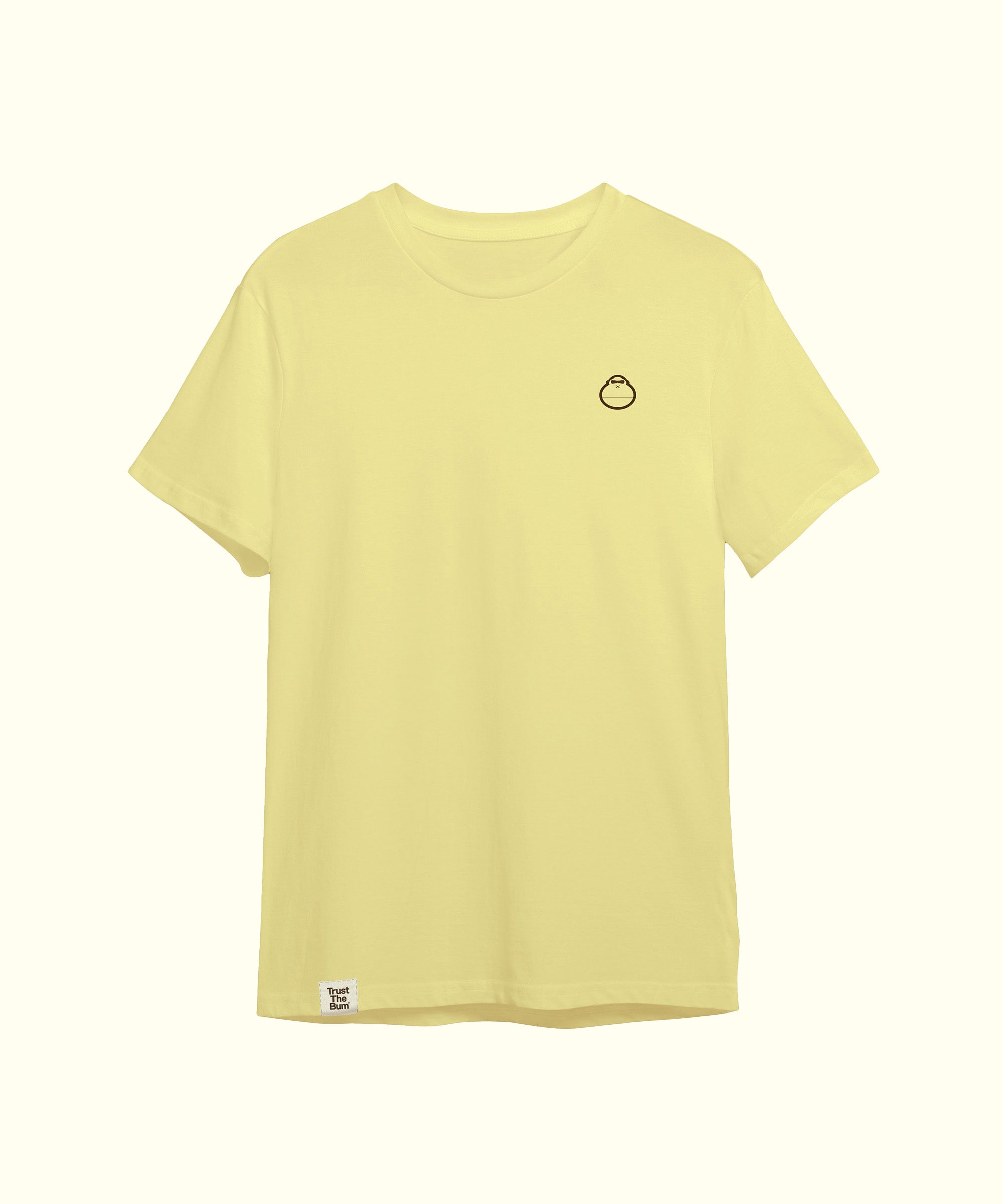 Light yellow plain tee featuring a small, minimalistic mascot logo on the left chest, perfect for casual wear. Sun Bum.