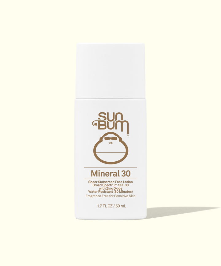 White bottle of Sun Bum Mineral 30 sunscreen face lotion, featuring the brand's monkey logo. Lightweight and water-resistant formula for effective sun protection. Sun Bum