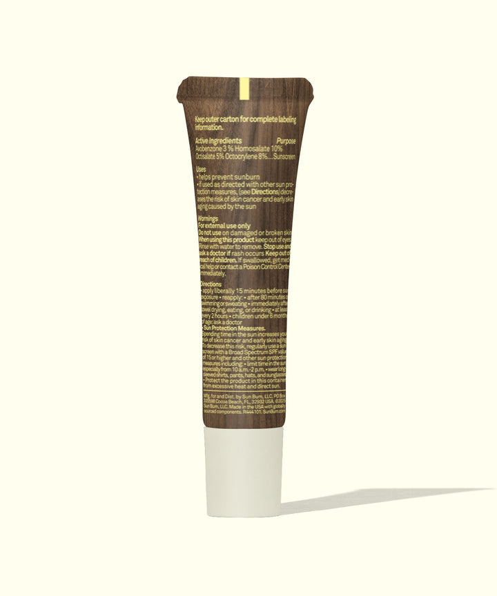 Coconut-flavored moisturizing lip balm tube with SPF 30 protection, featuring brown packaging and white cap. Ideal for hydrating and shielding lips from sun damage. Sun Bum